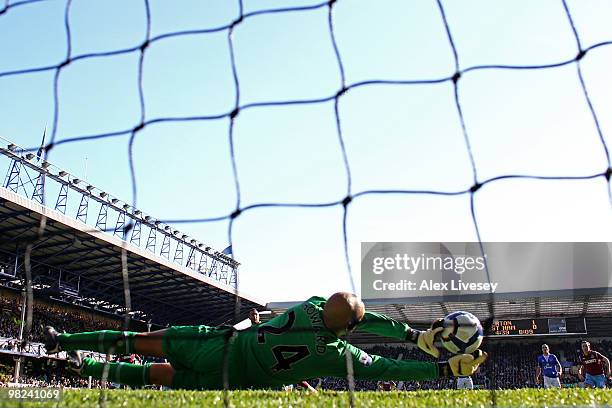 Tim Howard of Everton saves the penalty kick of Mido of West Ham United during the Barclays Premier League match between Everton and West Ham United...