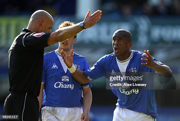 Sylvain Distin of Everton protests to Referee Howard Webb after he awarded a penalty to West Ham during the Barclays Premier League match between...