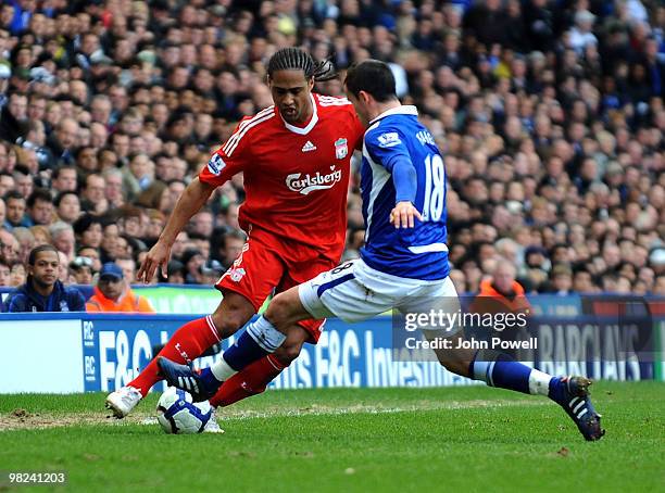 Glen Johnson of Liverpool competes with Keith Fahey of Birmingham during the Barclays Premier League match between Birmingham City and Liverpool at...