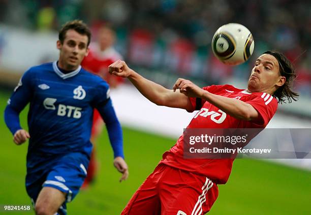 Tomislav Dujmovic of FC Lokomotiv Moscow battles for the ball with Luke Wilkshire of FC Dynamo Moscow during the Russian Football League Championship...