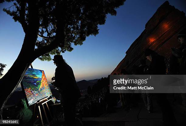 Artist Scramble Campbell of Morrison, Colorado paints his interpretation of the scene during the sixty-third annual Easter Sunrise Service at Red...