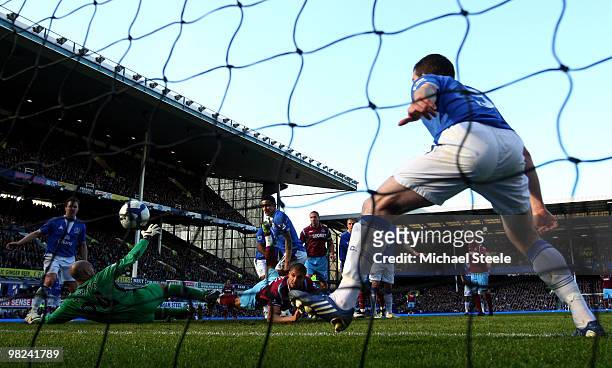 Araujo Ilan of West Ham United scores his team's second goal past Tim Howard of Everton during the Barclays Premier League match between Everton and...
