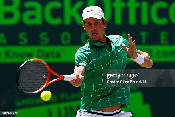 Tomas Berdych of the Czech Republic returns a shot against Andy Roddick of the United States during the men's final of the 2010 Sony Ericsson Open at...