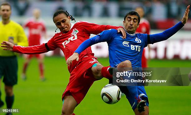 Peter Odemwingie of FC Lokomotiv Moscow battles for the ball with Aleksandr Samedov of FC Dynamo Moscow during the Russian Football League...