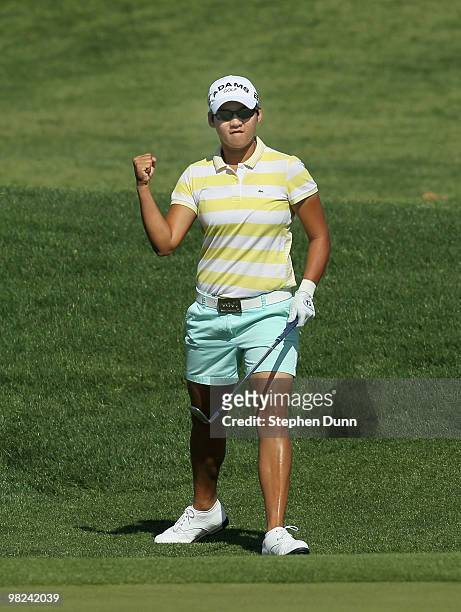 Yani Tseng of Taiwan pumps her fist after chipping for an eagle on the dsecond hole during the final round of the Kraft Nabisco Championship at...