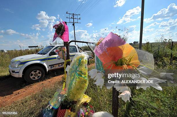 South African police car blocks the entrance to the farm of far right-wing leader Euguene Terre'Blanche's property where he was killed in the...