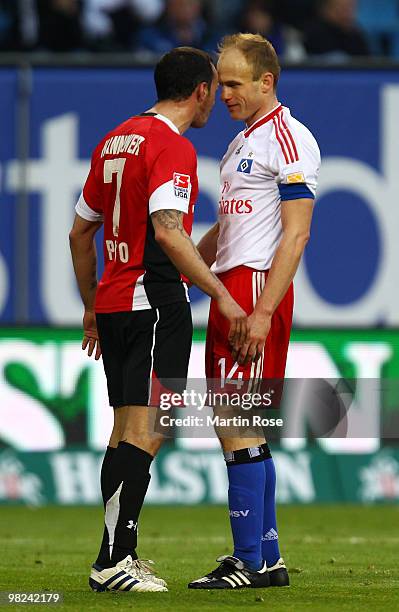 David Jarolim of Hamburg argues with Sergio Pinto of Hannover during the Bundesliga match between Hamburger SV and Hannover 96 at HSH Nordbank Arena...