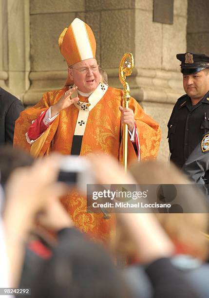 Archbishop Timothy Dolan enters St. Patrick's Cathedral to celebrate Easter Mass during the annual Easter Parade outside of St. Patrick's Cathedral...