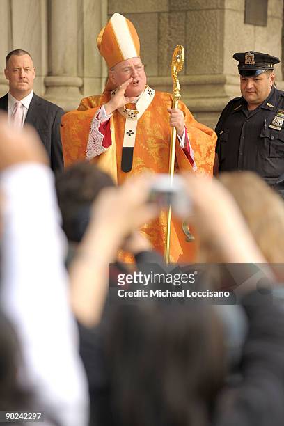 Archbishop Timothy Dolan enters St. Patrick's Cathedral to celebrate Easter Mass during the annual Easter Parade outside of St. Patrick's Cathedral...