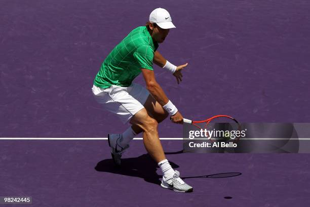 Tomas Berdych of the Czech Republic returns a shot against Andy Roddick of the United States during the men's final of the 2010 Sony Ericsson Open at...