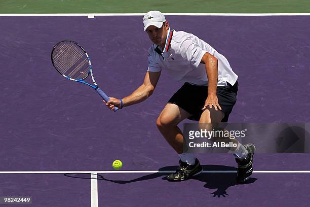 Andy Roddick of the United States returns a shot against Tomas Berdych of the Czech Republic during the men's final of the 2010 Sony Ericsson Open at...