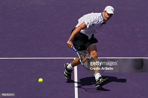 Andy Roddick of the United States returns a shot against Tomas Berdych of the Czech Republic during the men's final of the 2010 Sony Ericsson Open at...