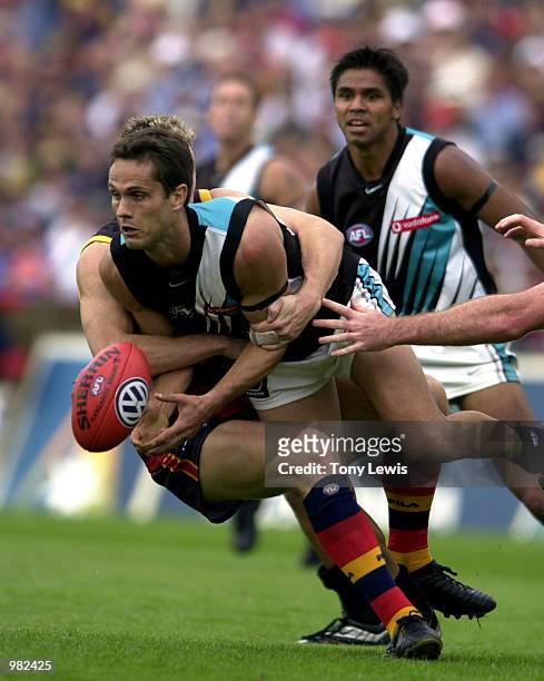 Gavin Wanganeen for Port Adelaide is tackled in the match between the Adelaide Crows and Port Power in round 3 of the AFL played at Football Park in...