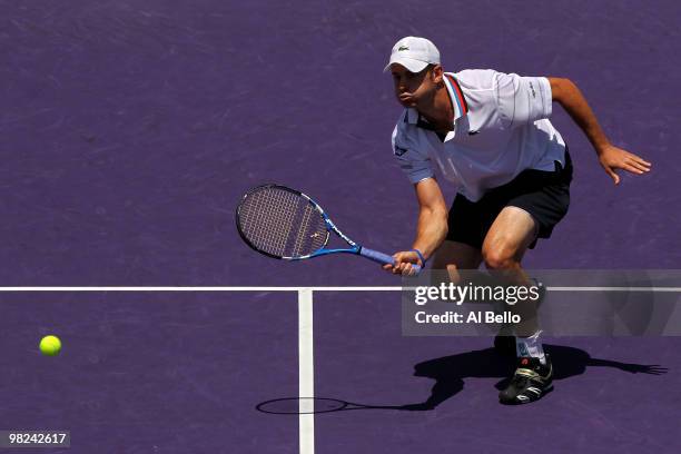 Andy Roddick of the United States returns a shot against Tomas Berdych of the Czech Republic during the men's final of the 2010 Sony Ericsson Open at...