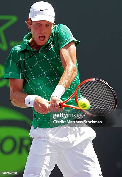 Tomas Berdych of the Czech Republic returns a shot against Andy Roddick of the United States during the men's final of the 2010 Sony Ericsson Open at...