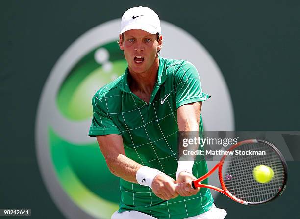 Tomas Berdych of the Czech Republic returns a shot against Andy Roddick of the United States during the men's final of the 2010 Sony Ericsson Open at...