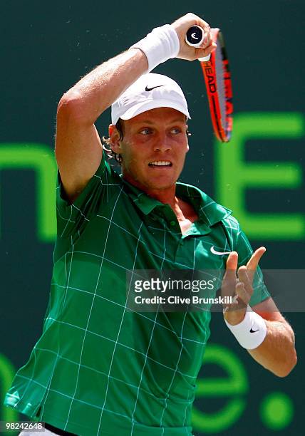 Tomas Berdych of the Czech Republic returns a shot against Andy Roddick of the United States during the men's final of the 2010 Sony Ericsson Open at...