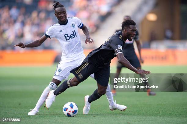 Whitecaps Forward Kei Kamara knocks Union Forward CJ Sapong off the ball and to the ground in the first half during the game between Vancouver...