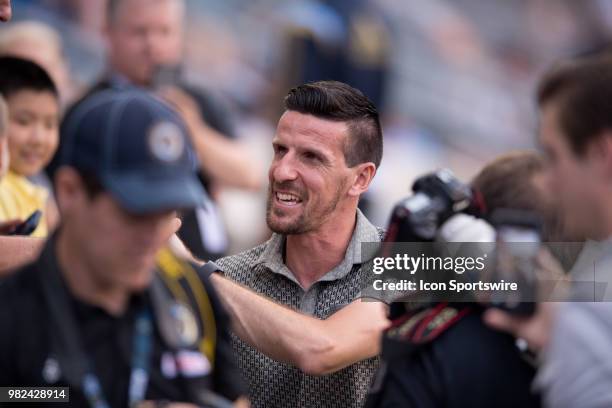 Sébastien Le Toux shakes hands with fans after being inducted into the Ring of Honor during the game between Vancouver Whitecaps FC and the...