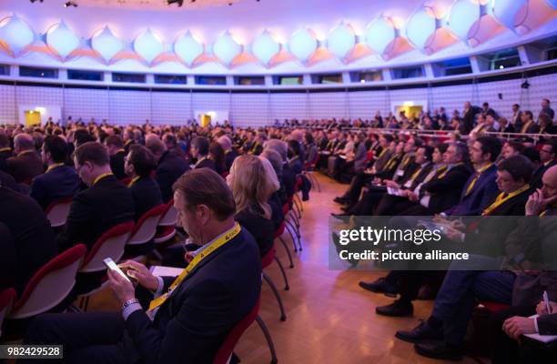 Congress participants listen to the opening speech by Holger Muench, President of the Federal Criminal Police Office, during the opening ceremony of...