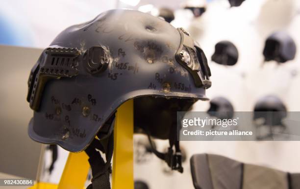 The helmet manufacturer Ulbrichts Protection, displays a helmet which was shot several times at an exhibition of the European Police Congress in...