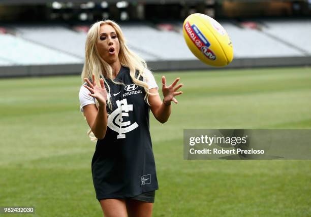 Smackdown women's champion Carmella and WWE'S world champion AJ Styles show their football skills at the Melbourne Cricket Ground on June 24, 2018 in...