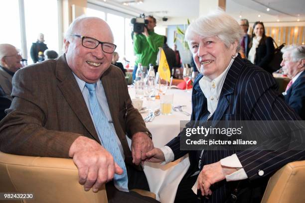 The "Ehren-Alster-Schleusenwaerter" , the former soccer player Uwe Seeler, and his wife Ilka smiling during a ceremony in a café at the Binnenalster...