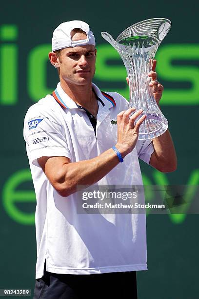 Andy Roddick of the United States holds up the trophy after defeating Tomas Berdych of the Czech Republic in straight sets to win the men's final of...