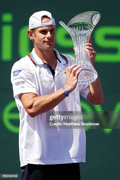 Andy Roddick of the United States holds up the trophy after defeating Tomas Berdych of the Czech Republic in straight sets to win the men's final of...