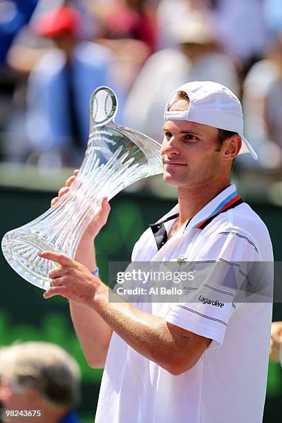 Andy Roddick of the United States holds up the trophy after defeating Tomas Berdych of the Czech Republic in straight sets to win the men's final of...
