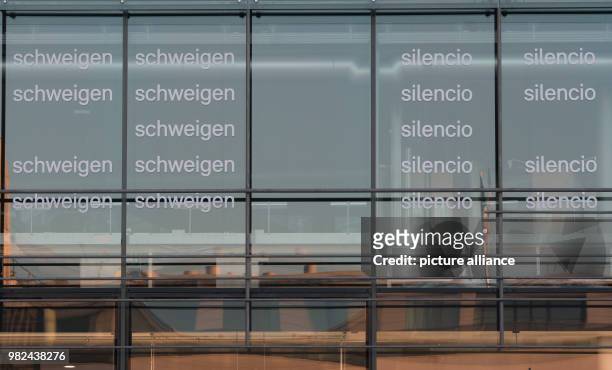 The words "silence" and "Silencio" are written on the glas facade of the Academy of Arts in Duesseldorf, Germany, 06 Febuary 2018. The protest...