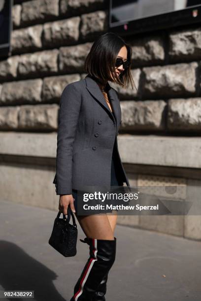 Aimee Song is seen on the street during Paris Men's Fashion Week S/S 2019 wearing Dior on June 23, 2018 in Paris, France.