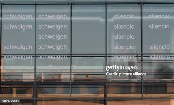 The words "silence" and "Silencio" are written on the glas facade of the Academy of Arts in Berlin, Germany, 06 Febuary 2018. The protest campaign is...