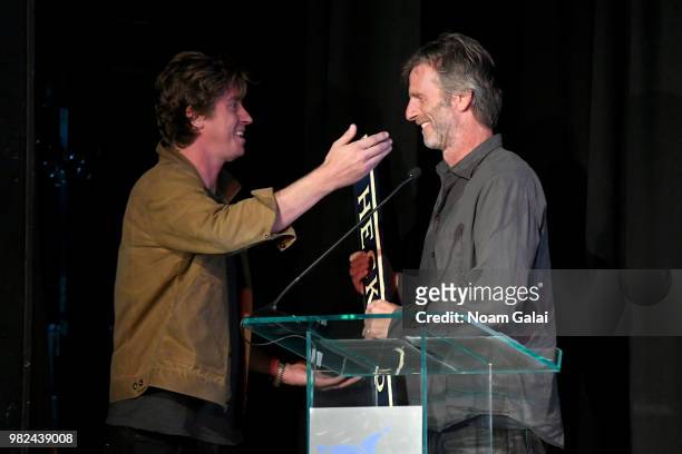 Garrett Hedlund presents an award to Andrew Heckler onstage during the Screenwriters Tribute at the 2018 Nantucket Film Festival - Day 4 on June 23,...