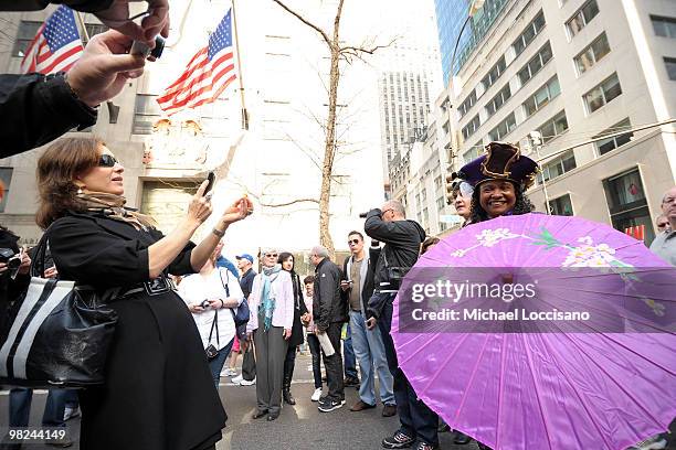 An attendee has her photo taken during the annual Easter Parade bonnet and costume-wearing festivities on April 4, 2010 in New York City. The parade...