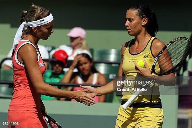 Gisela Dulko of Argentina and Flavia Pennetta of Italy play against Samantha Stosur of Australia and Nadia Petrova of Russia during the women's...