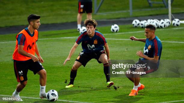 Alvaro Odriozola of Spain, Marco Asensio of Spain and Lucas Vazquez of Spain battle for the ball during a training session on June 8, 2018 in...