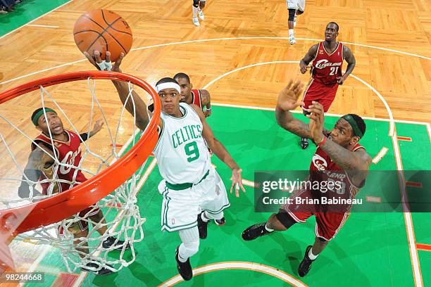 Rajon Rondo of the Boston Celtics lays the ball up in the lane against LeBron James of the Cleveland Cavaliers on April 4, 2010 at the TD Garden in...