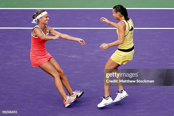 Gisela Dulko of Argentina and Flavia Pennetta of Italy celebrate after defeating Samantha Stosur of Australia and Nadia Petrova of Russia to win the...