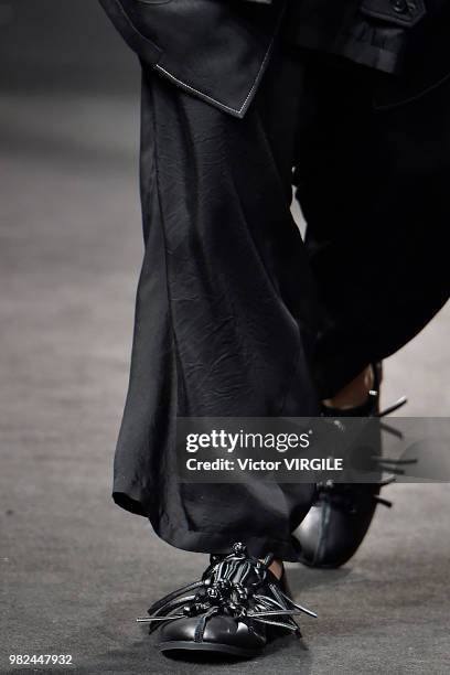 Model walks the runway during the Yohji Yamamoto Menswear Spring/Summer 2019 fashion show as part of Paris Fashion Week on June 21, 2018 in Paris,...