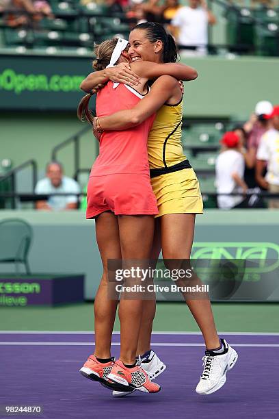 Gisela Dulko of Argentina and Flavia Pennetta of Italy celebrate after defeating Samantha Stosur of Australia and Nadia Petrova of Russia to win the...