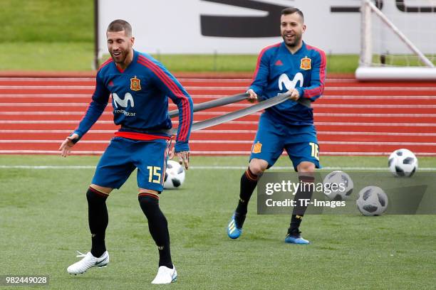 Jordi Alba of Spain and Sergio Ramos of Spain controls the ball during a training session on June 6, 2018 in Madrid, Spain.