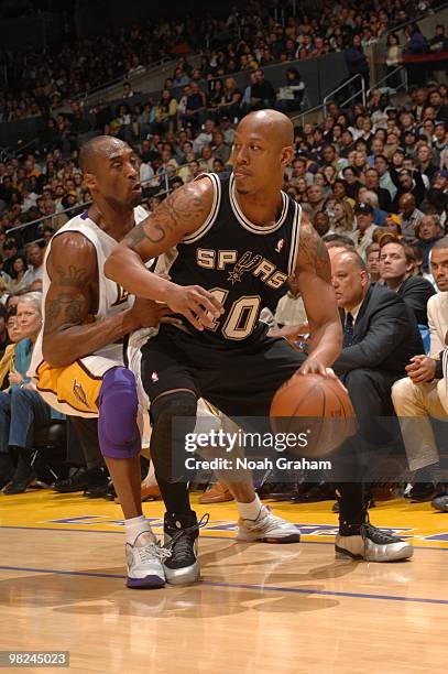 Keith Bogans of the San Antonio Spurs dribbles against Kobe Bryant of the Los Angeles Lakers at Staples Center on April 4, 2010 in Los Angeles,...