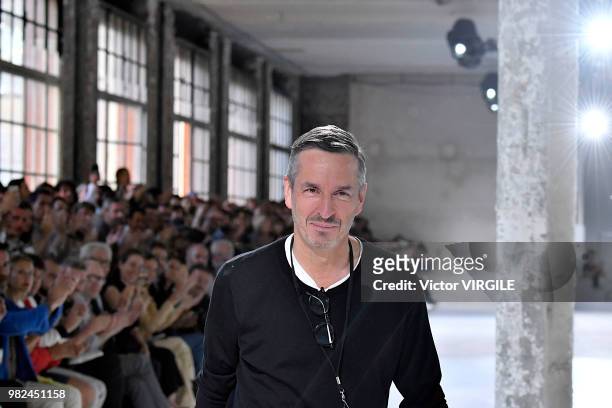 Fashion designer Dries van Noten walks the runway during the Dries Van Noten Menswear Spring/Summer 2019 fashion show as part of Paris Fashion Week...