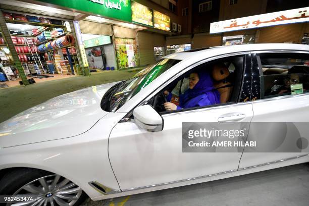 Saudi Samira Al-Ghamdi is seen in her car with family driving at food court in the coastal city of Jeddah for the first time. Little after midnight...