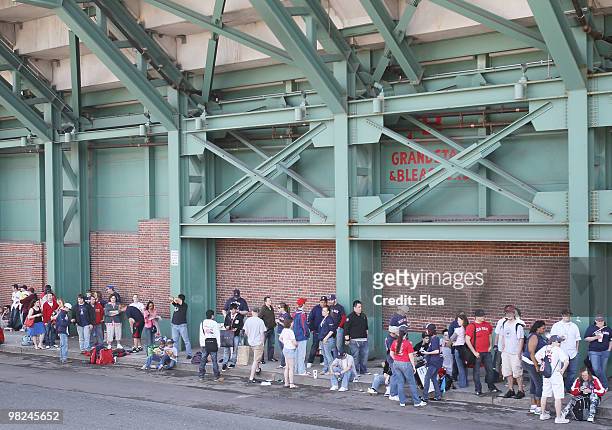 Fans line up in hopes of getting the available game day tickets before the Boston Red Sox take one the New York Yankees on April 4, 2010 during...