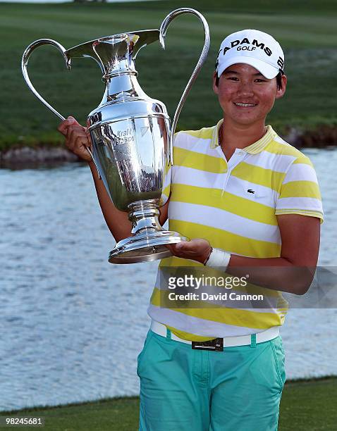 Yani Tseng of Taiwan proudly holds the trophy after her one shot victory in the 2010 Kraft Nabisco Championship, on the Dinah Shore Course at The...