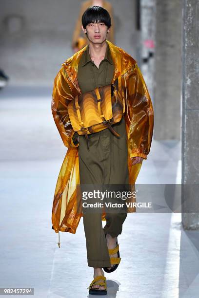 Model walks the runway during the Dries Van Noten Menswear Spring/Summer 2019 fashion show as part of Paris Fashion Week on June 21, 2018 in Paris,...