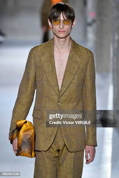 Model walks the runway during the Dries Van Noten Menswear Spring/Summer 2019 fashion show as part of Paris Fashion Week on June 21, 2018 in Paris,...