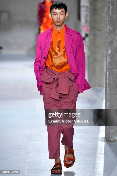 Model walks the runway during the Dries Van Noten Menswear Spring/Summer 2019 fashion show as part of Paris Fashion Week on June 21, 2018 in Paris,...